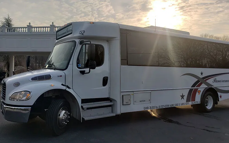 White 26 Passenger Luxury Coach with tinted windows