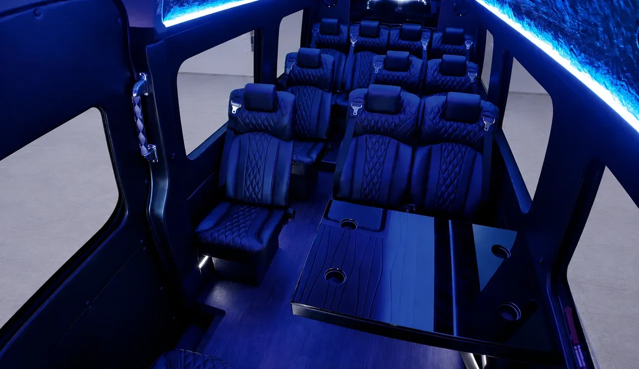 Black Luxury Sprinter Shuttle Van Black Luxury Sprinter Shuttle Van cabin view with captain's chairs, passenger tables and cup holders