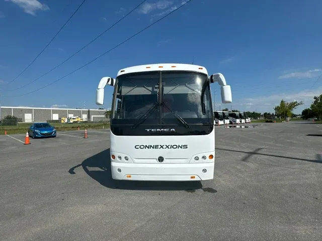 White 40 Passenger Charter Bus exterior angle