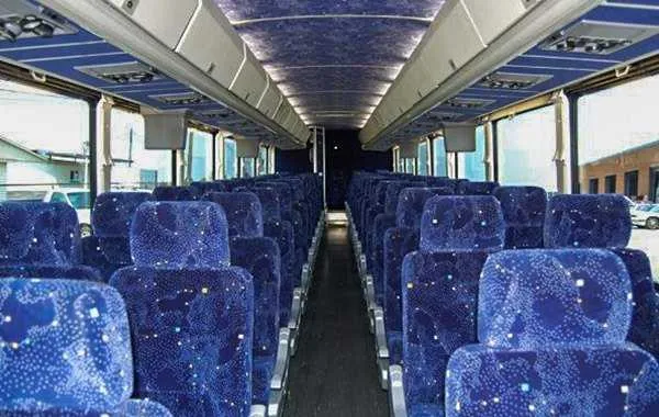 55 Passenger Charter Bus cabin view with overhead parcel racks