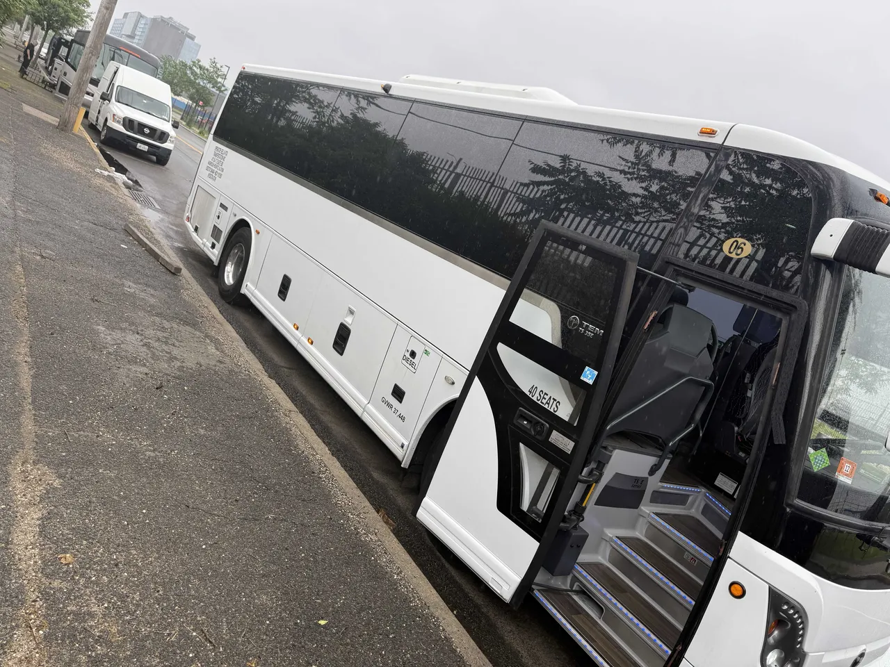 White 40 Passenger Charter Bus with tinted windows