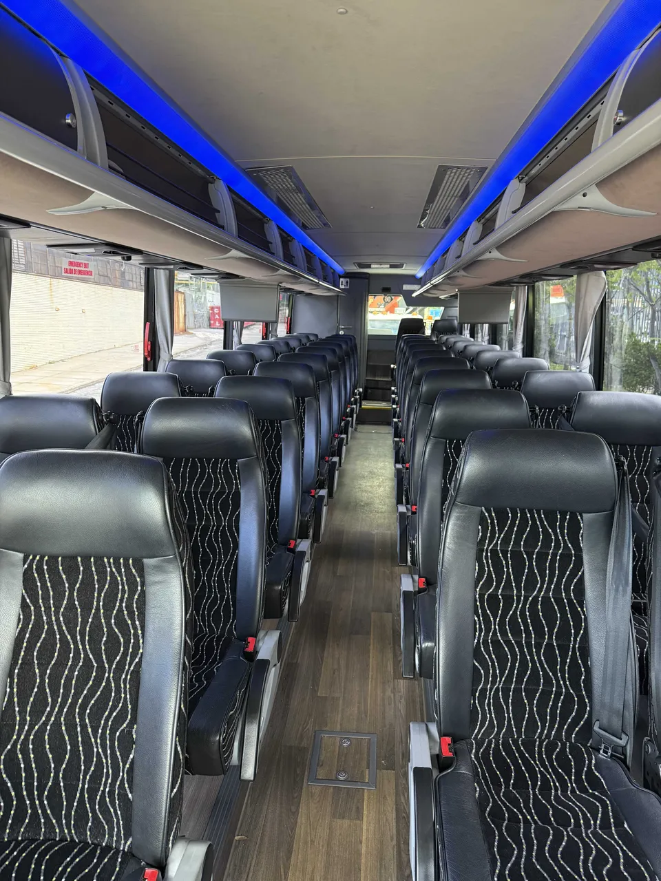 40 Passenger Charter Bus cabin view with LED accent lighting and overhead parcel racks