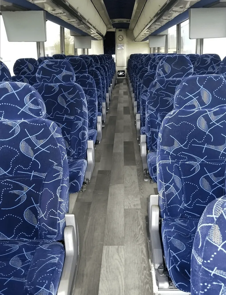 56 Passenger Charter Bus cabin view with overhead parcel racks