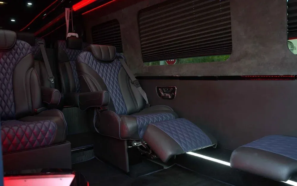 8 Passenger Executive Sprinter Shuttle Van 8 Passenger Executive Sprinter Shuttle Van cabin view with captain's chairs, window shades and LED accent lighting
