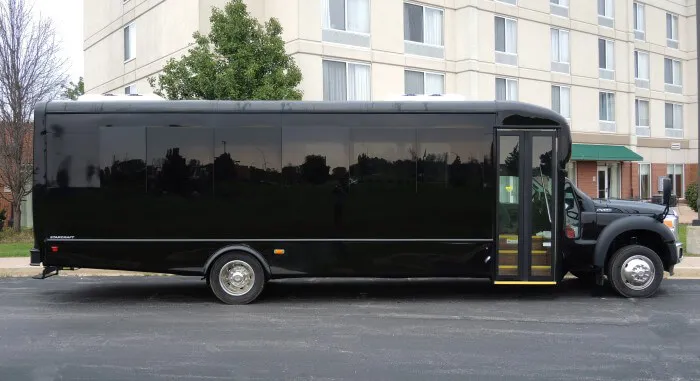 Black 28 Passenger Ford F550 Executive VIP Mini Coach exterior angle