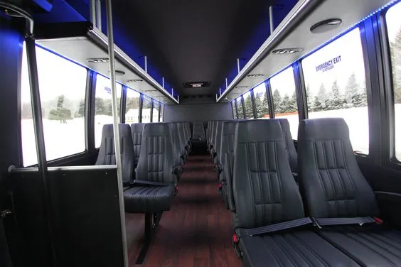 44 Passenger Ford F650 Executive VIP Shuttle Bus cabin view with LED accent lighting and grab handles and rails