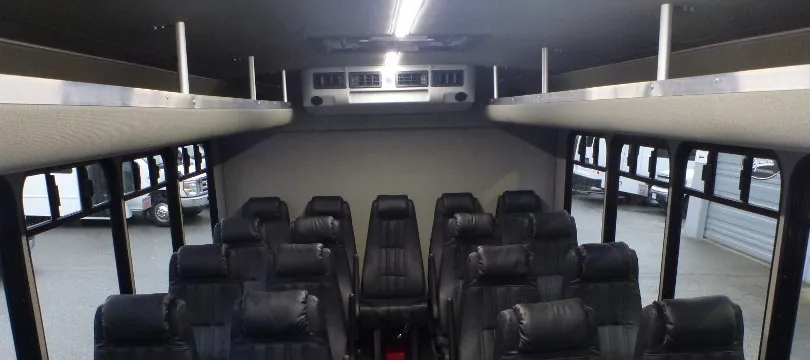 32 Passenger Ford F600 Executive VIP Shuttle Bus cabin view with overhead parcel racks