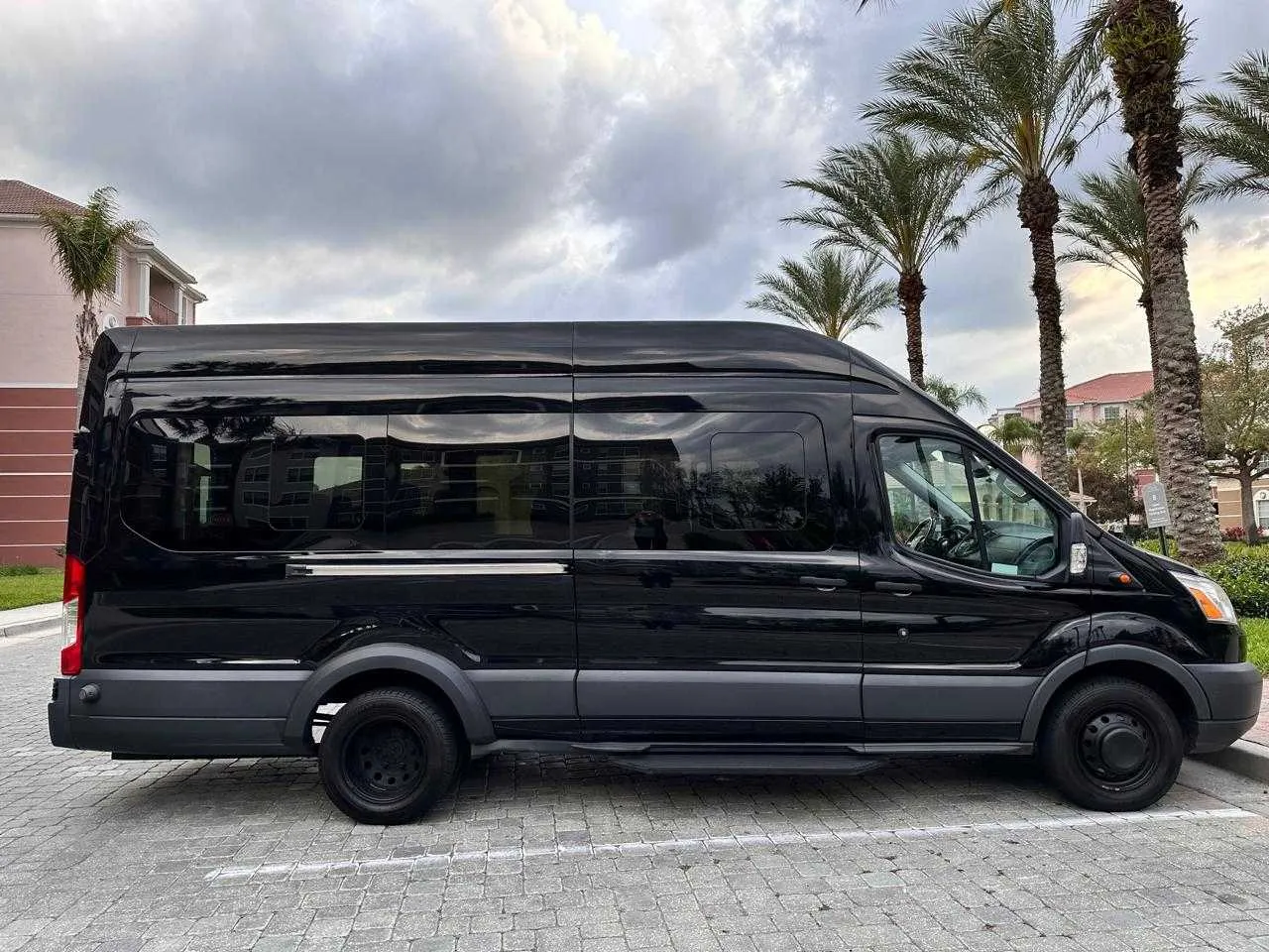 Black Ford Minibus with tinted windows