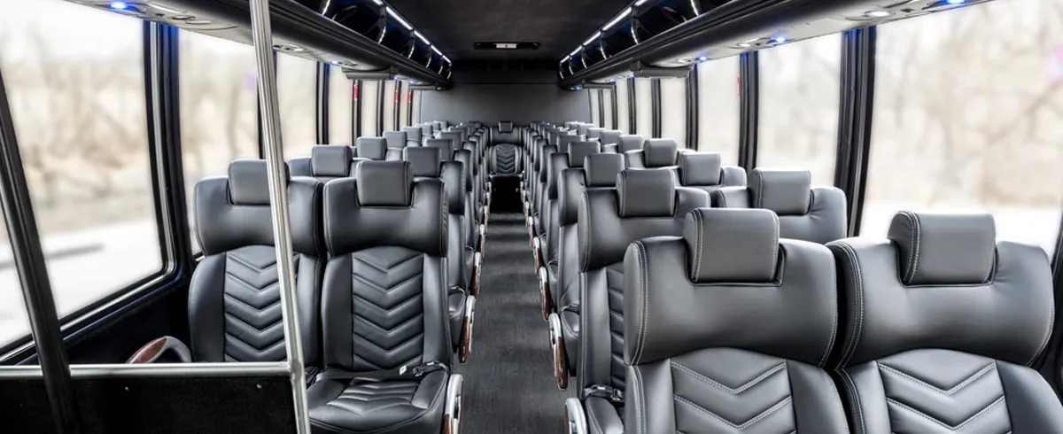 Freightliner 40 Passenger Shuttle Bus (White) cabin view with airline-style seats and grab handles and rails