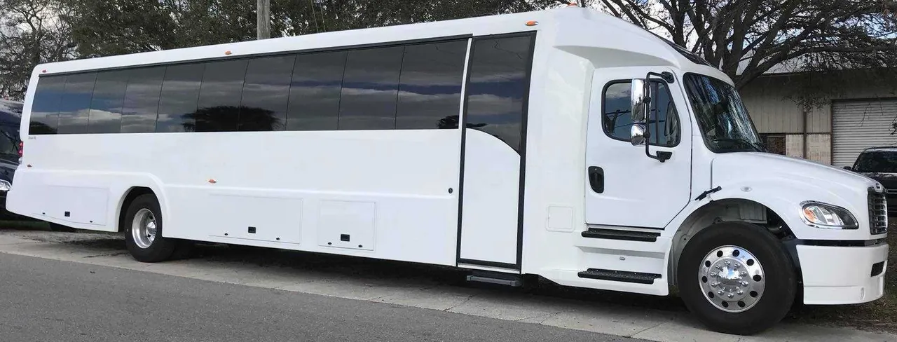 White Freightliner Luxury Coach with tinted windows