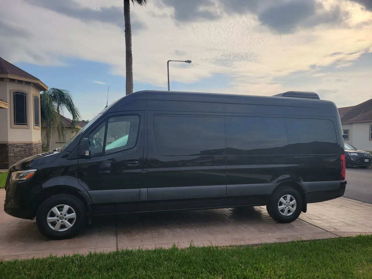 Black Mercedes-Benz Sprinter Passenger Van, angle 2