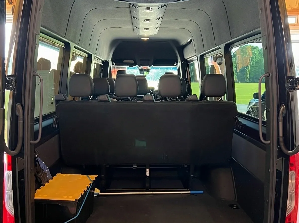 Black Mercedes-Benz Sprinter Shuttle Van, angle 4