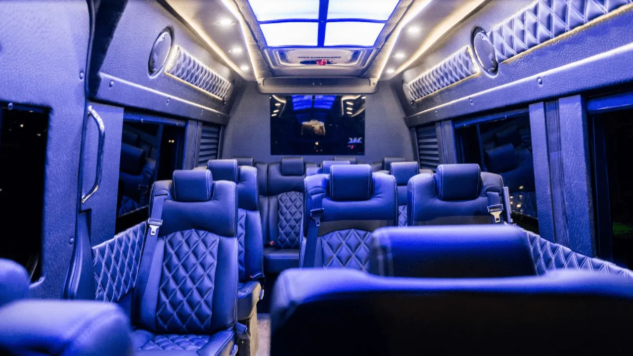 Mercedes-Benz Executive Sprinter cabin view with captain's chairs, LED accent lighting and TV screens