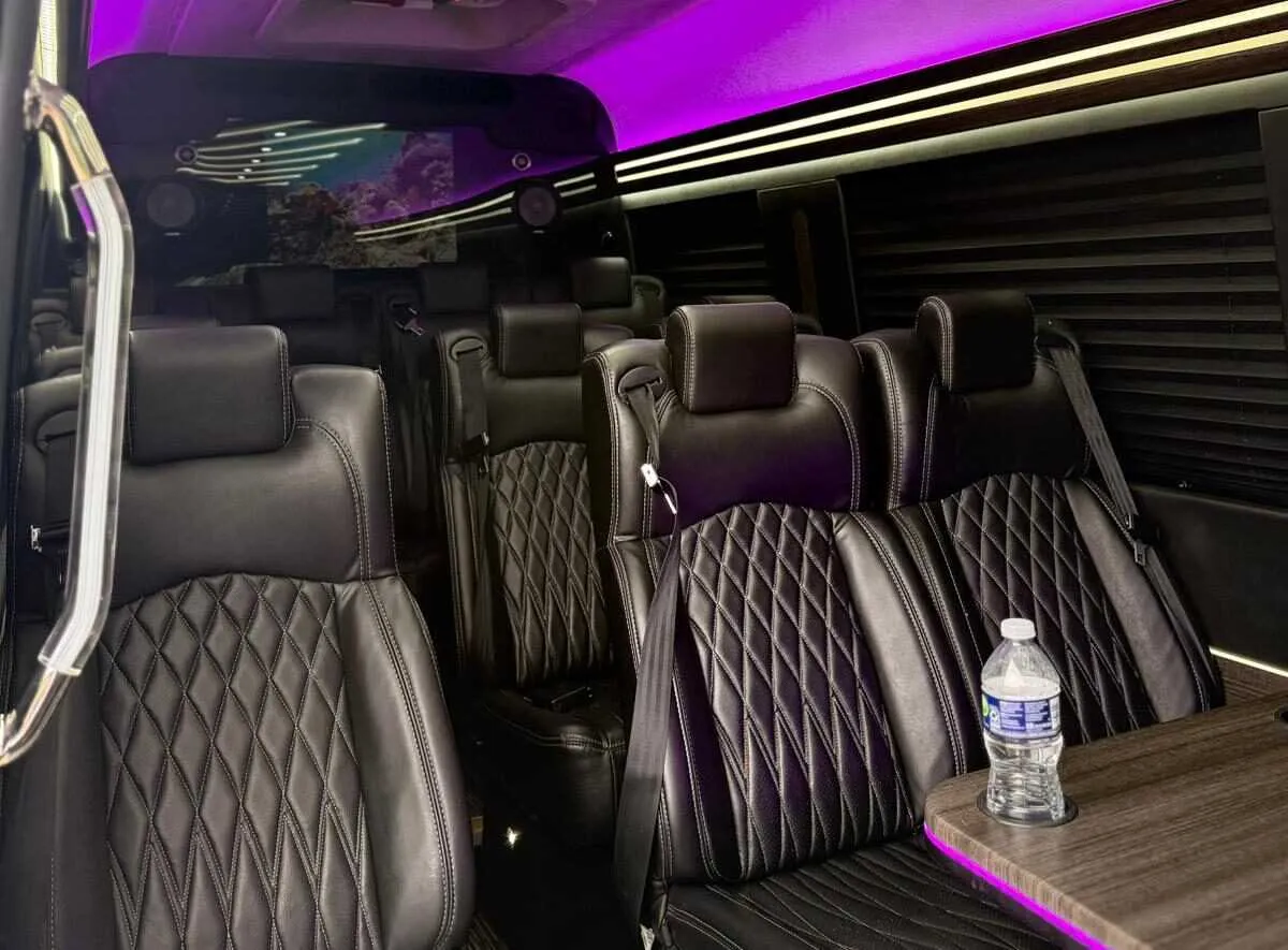 Mercedes-Benz Executive Sprinter Mercedes-Benz Executive Sprinter cabin view with captain's chairs, passenger tables and window shades