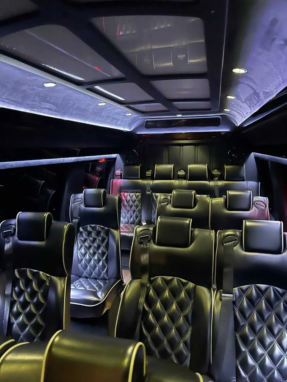 Mercedes-Benz Executive Sprinter cabin view with captain's chairs and LED ceiling lighting