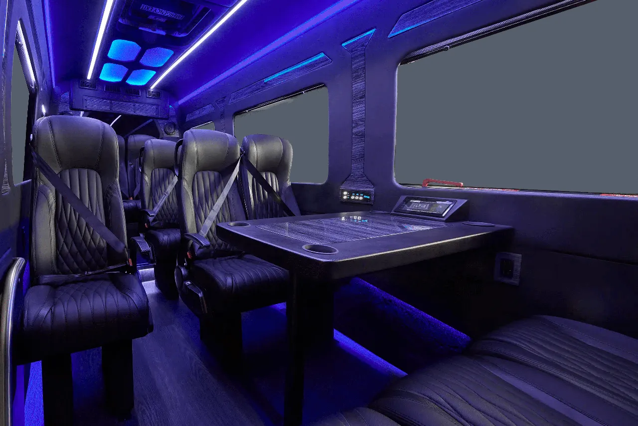 Mercedes-Benz Executive Sprinter Mercedes-Benz Executive Sprinter cabin view with captain's chairs, passenger tables and LED accent lighting
