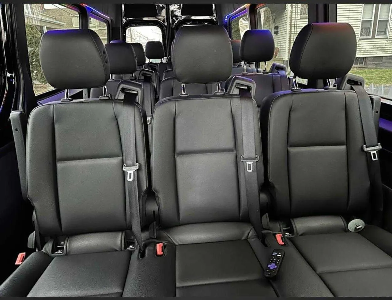 Mercedes-Benz Sprinter cabin view with passenger seat belts