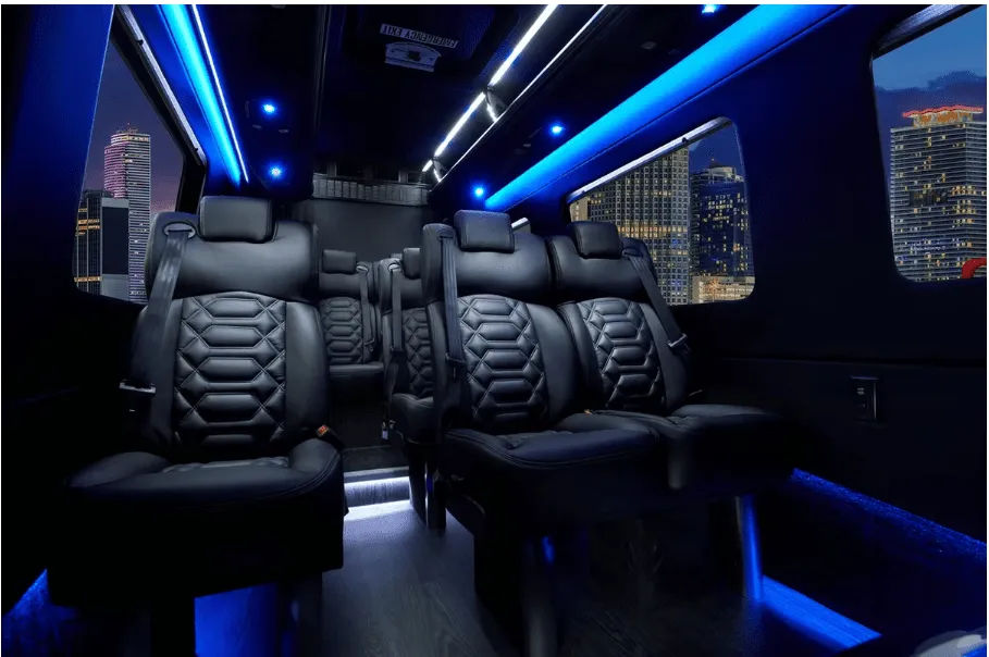 Mercedes-Benz Sprinter cabin view with captain's chairs, LED accent lighting and LED ceiling lighting
