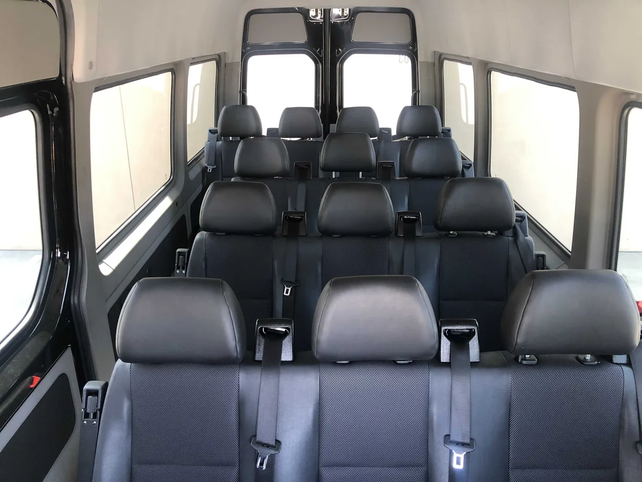 Mercedes-Benz Sprinter cabin view with passenger seat belts