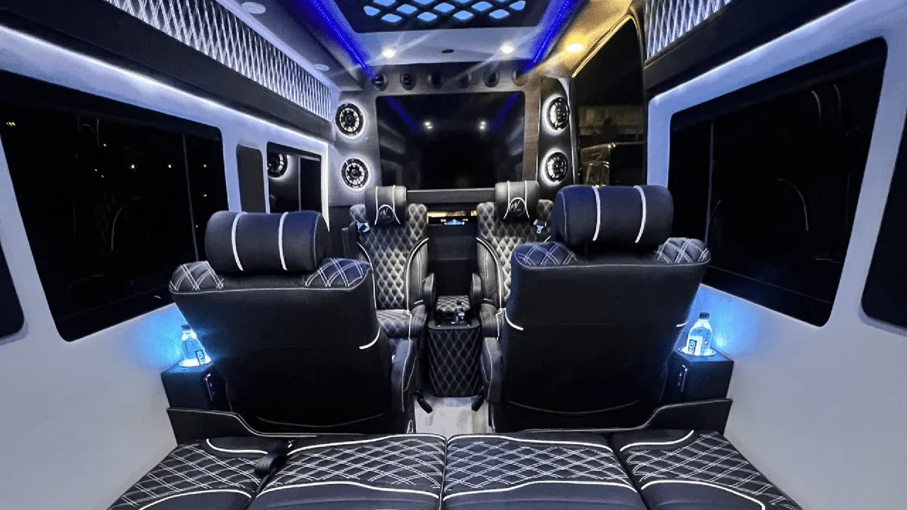 Mercedes-Benz Sprinter Jet cabin view with captain's chairs, cup holders and LED ceiling lighting