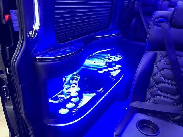 11 Passenger Mercedes-Benz Sprinter Luxury cabin view with captain's chairs, cup holders and window shades