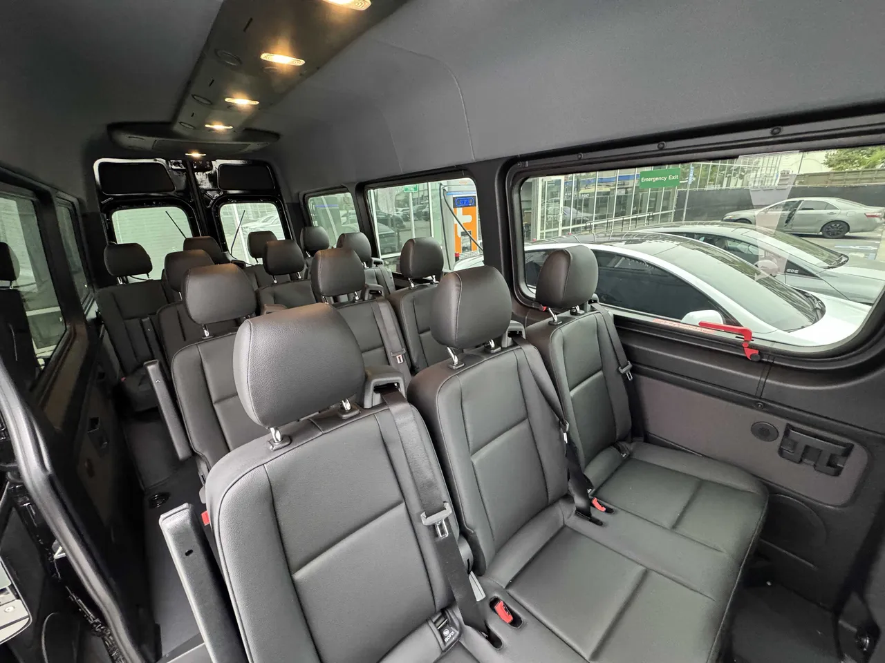 Mercedes Sprinter Van cabin view with passenger seat belts