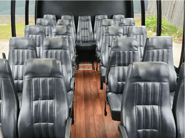 24 Passenger Mini Bus cabin view with wood-look flooring