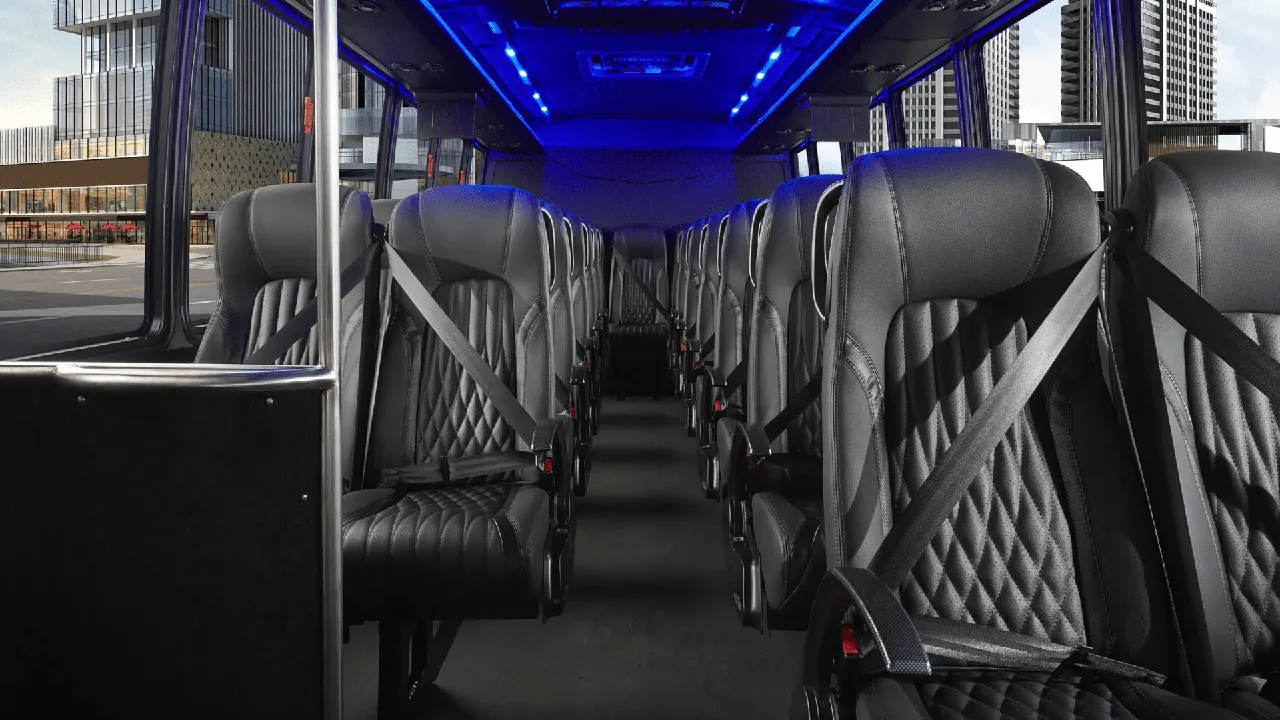 28 Passenger Mini Coach cabin view with LED ceiling lighting and passenger seat belts