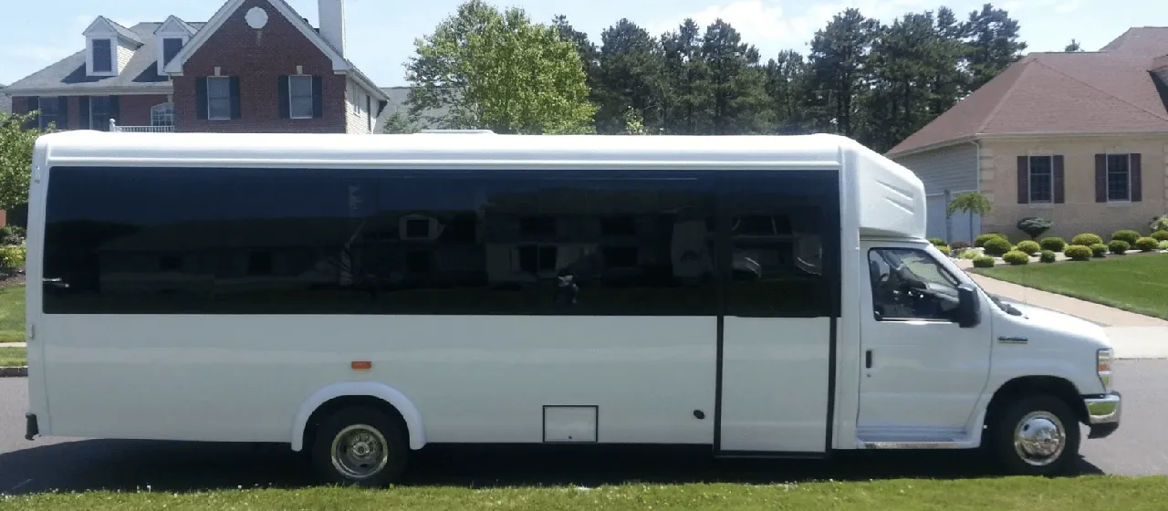 White 32 Passenger Mini Coach with tinted windows