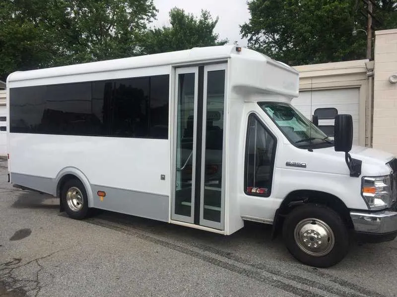 14 Passenger Mini Coach White 14 Passenger Mini Coach with tinted windows