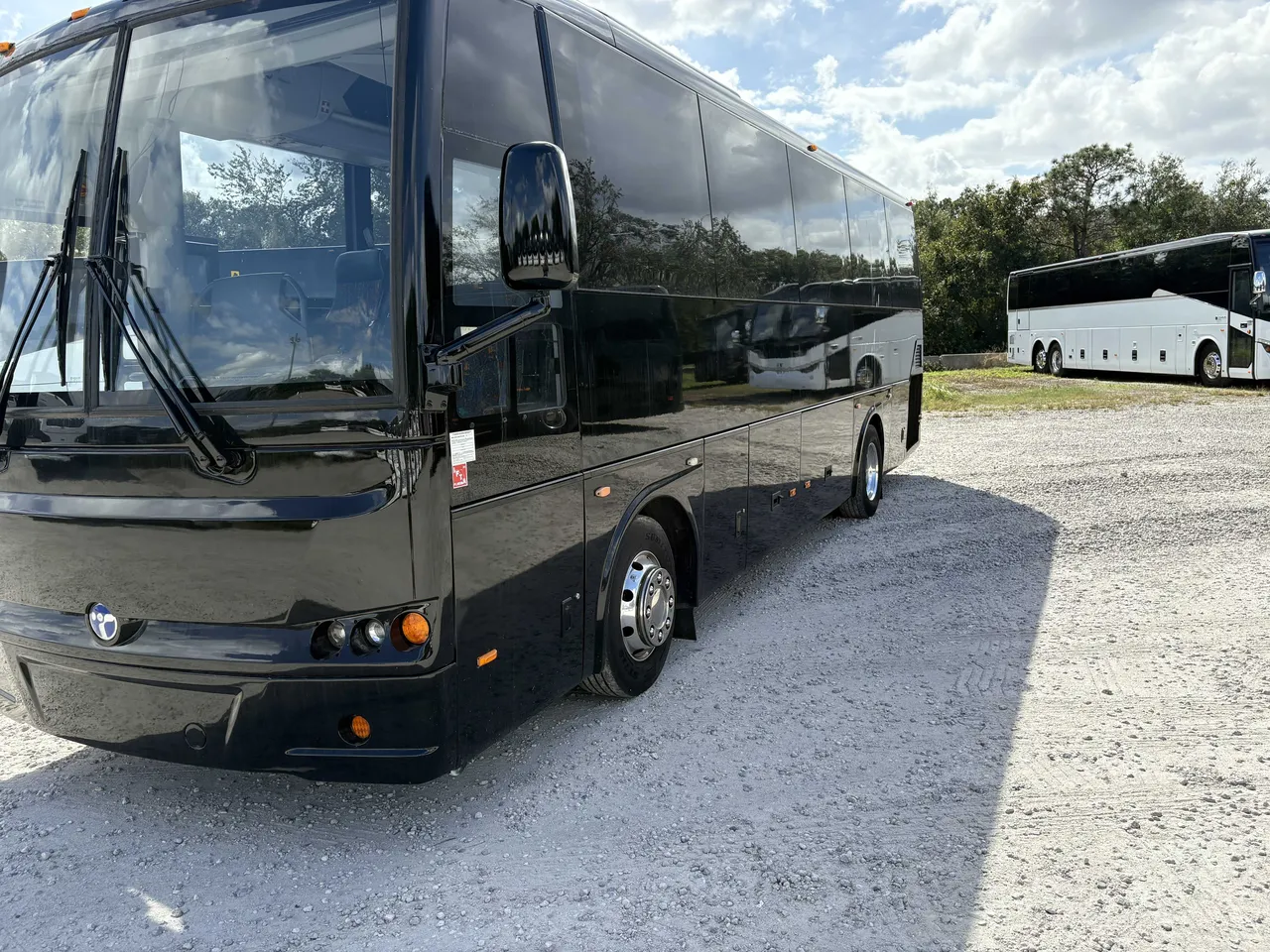 Black 24 Passenger Mini Coach with tinted windows
