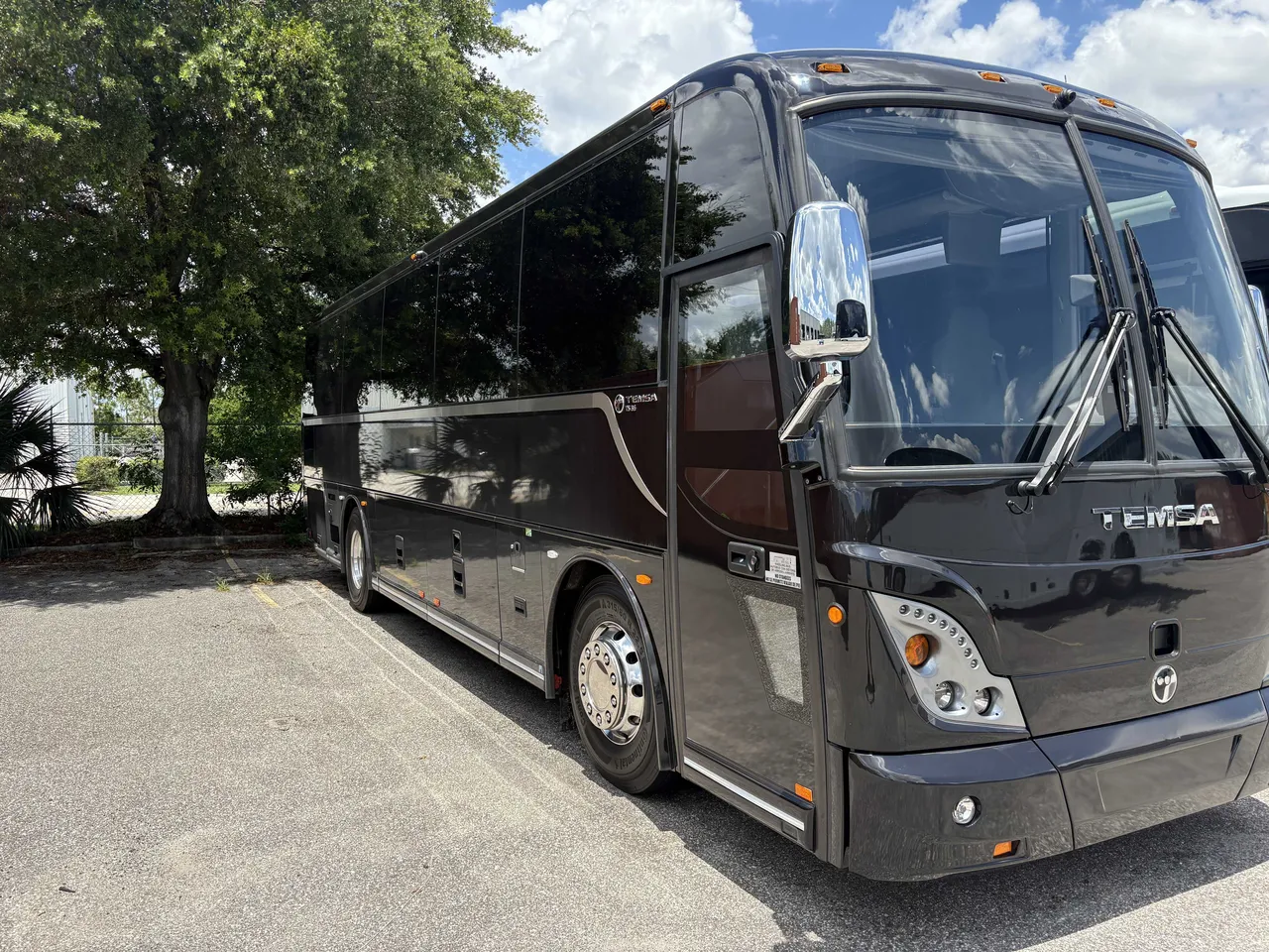 Black 40 Passenger Mini Coach with tinted windows