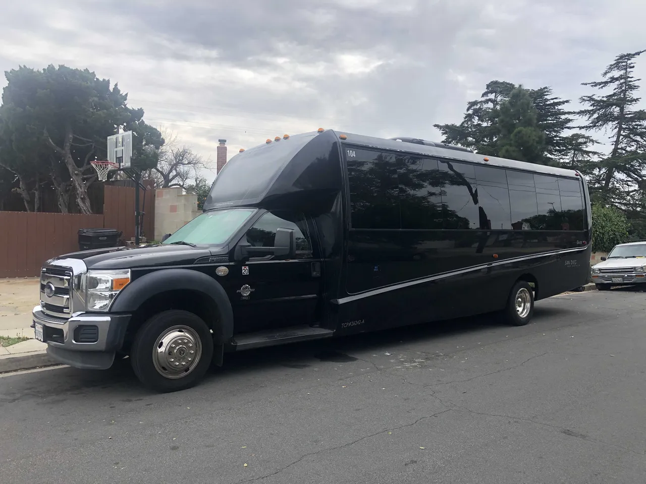 Black 21 Passenger Mini Coach with tinted windows
