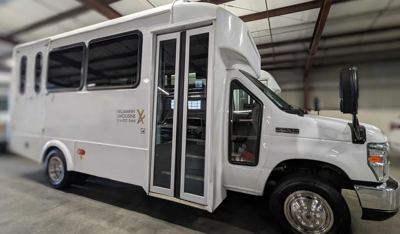 White Mini Moto Coach with tinted windows