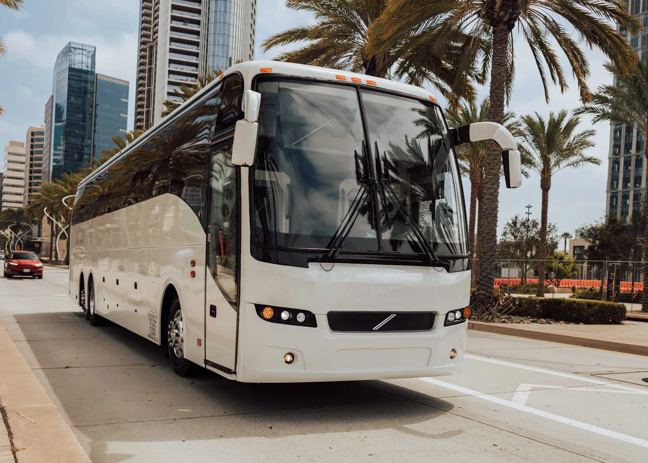 White 56 Passenger Motor Coach exterior angle, angle 4