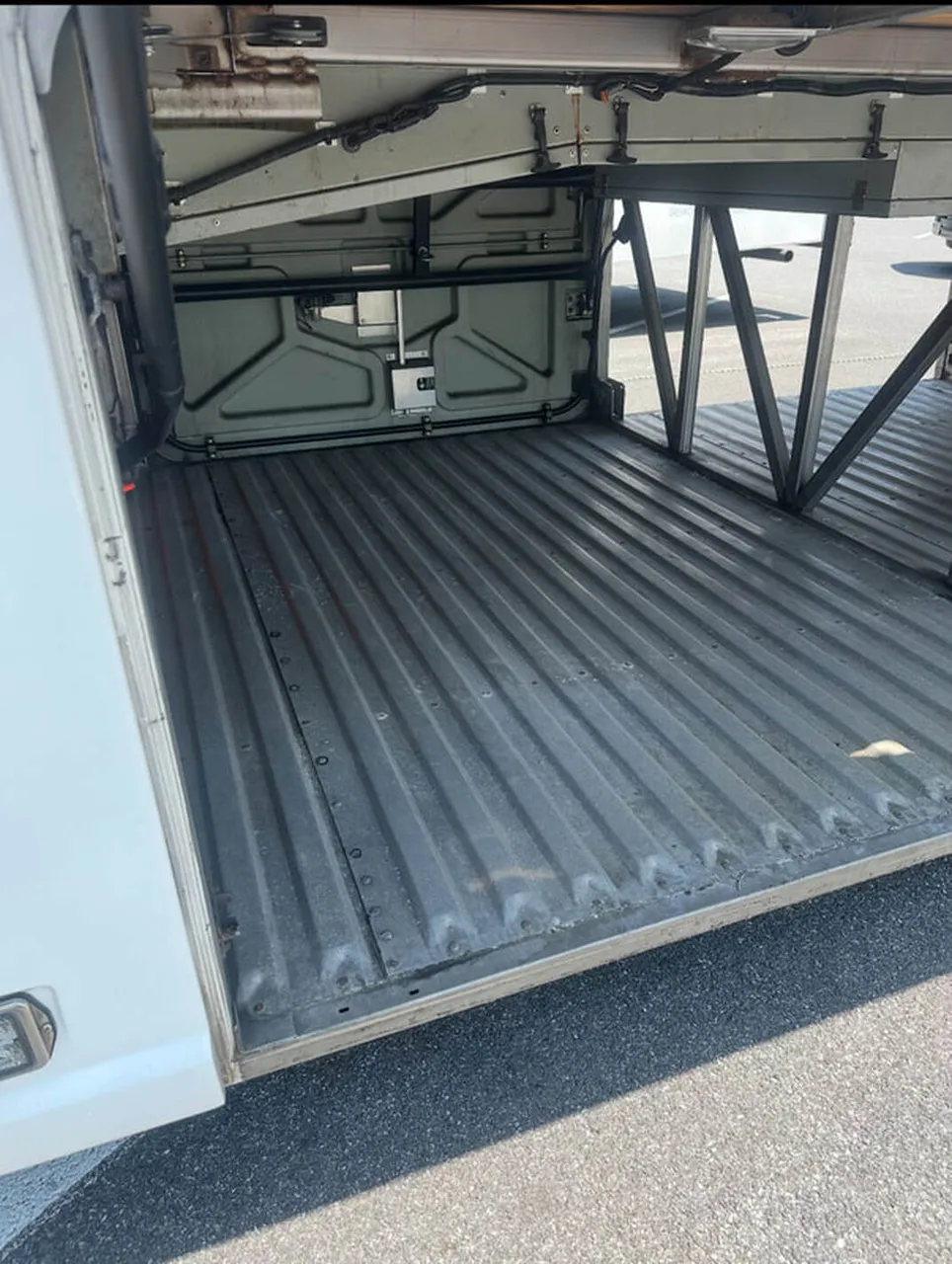 Motor Coach Luxury (Cloth Seats) close-up shot with under-floor luggage bays