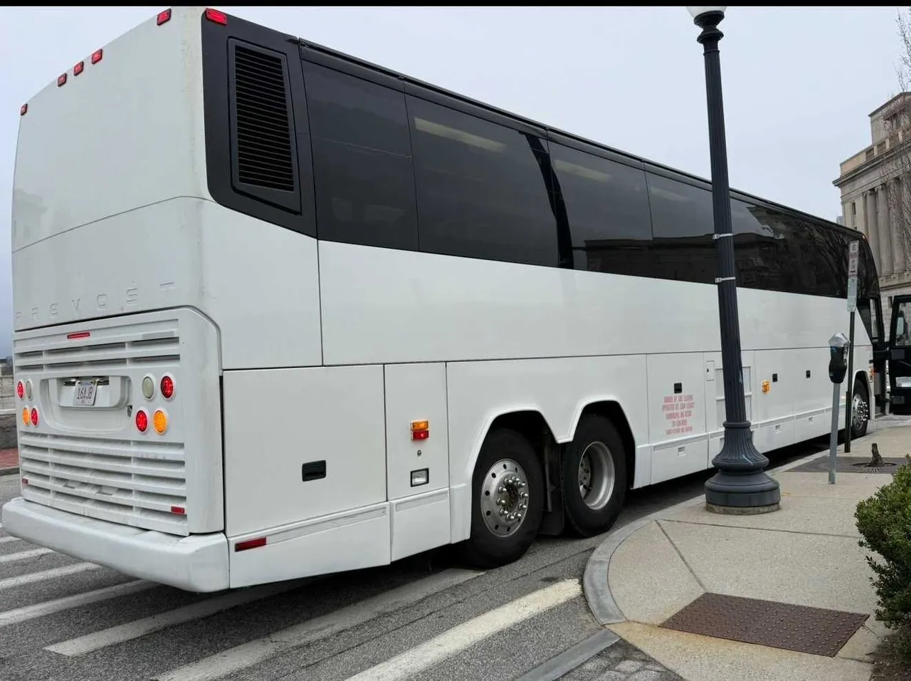 55 Passenger Motorcoach White 55 Passenger Motorcoach with tinted windows