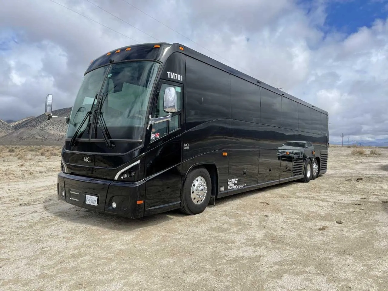 Black 56 Passenger Motorcoach exterior angle with tinted windows