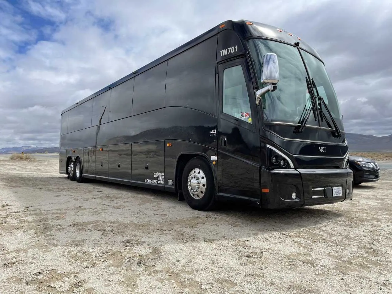 Black 56 Passenger Motorcoach with tinted windows
