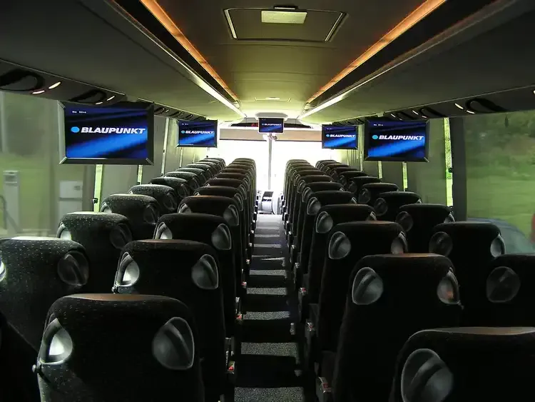 40 Passenger Motorcoach cabin view with LED ceiling lighting and TV screens