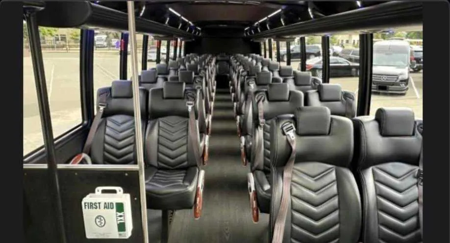 30 Passenger Shuttle Bus cabin view with LED ceiling lighting, passenger seat belts and overhead parcel racks