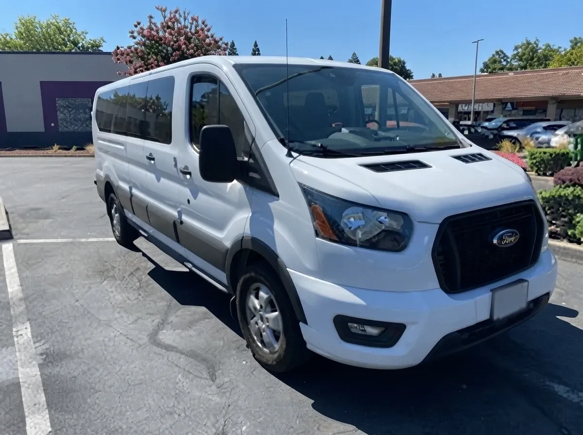 White 10 Passenger Transit Van to rent