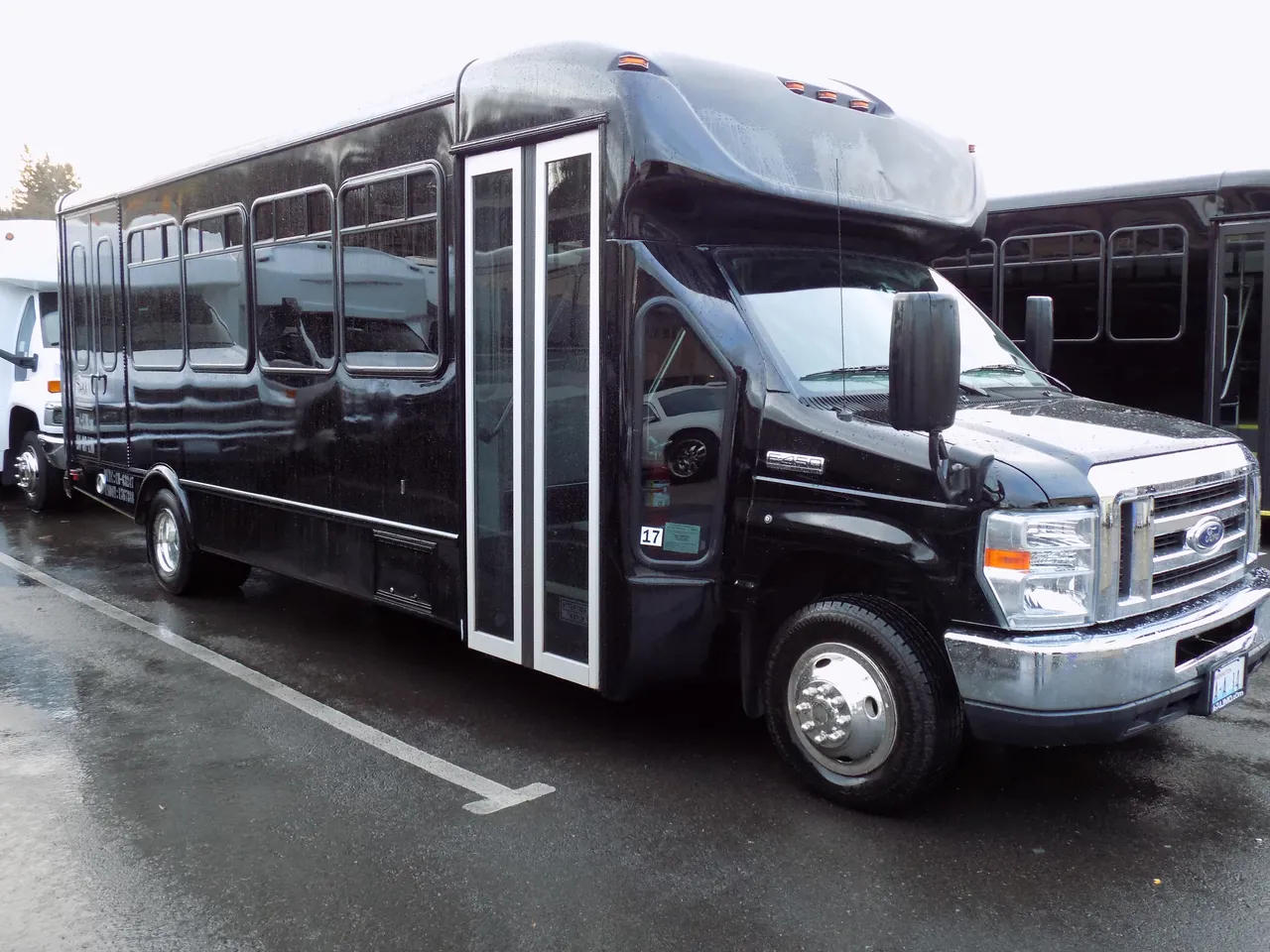 Black VIP Executive ADA Mini Coach with Wheelchair Lift exterior angle