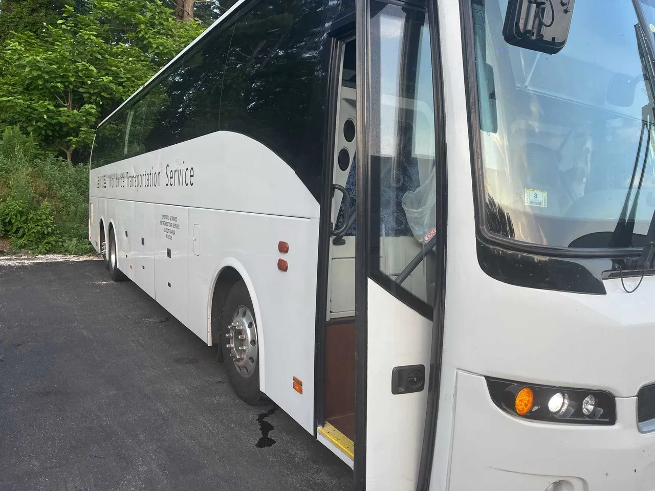White Volvo Motor Coach with tinted windows
